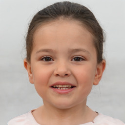 Joyful white child female with short  brown hair and brown eyes