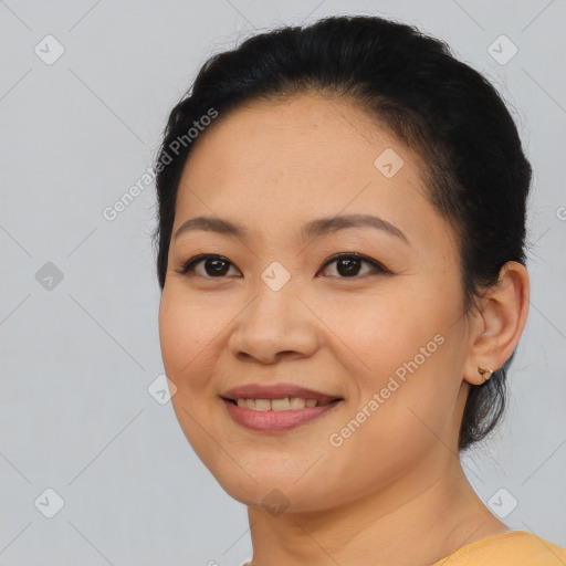 Joyful latino young-adult female with medium  black hair and brown eyes