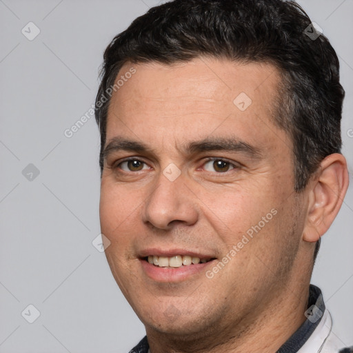 Joyful white adult male with short  brown hair and brown eyes