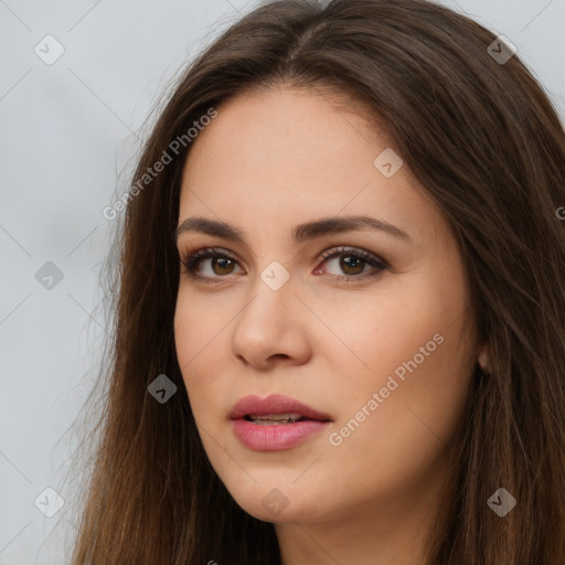 Neutral white young-adult female with long  brown hair and brown eyes