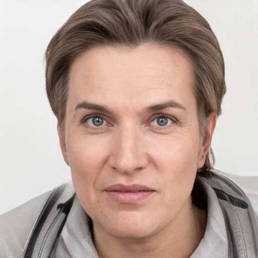 Joyful white adult male with short  brown hair and grey eyes