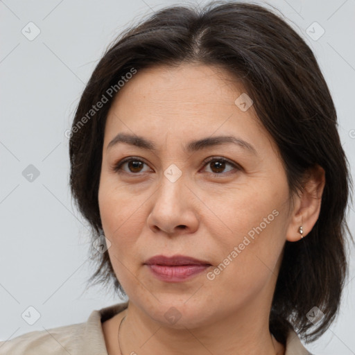 Joyful white adult female with medium  brown hair and brown eyes