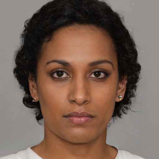 Neutral black young-adult female with short  brown hair and brown eyes