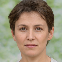 Joyful white adult female with short  brown hair and brown eyes