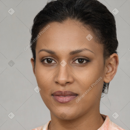 Joyful latino young-adult female with short  brown hair and brown eyes