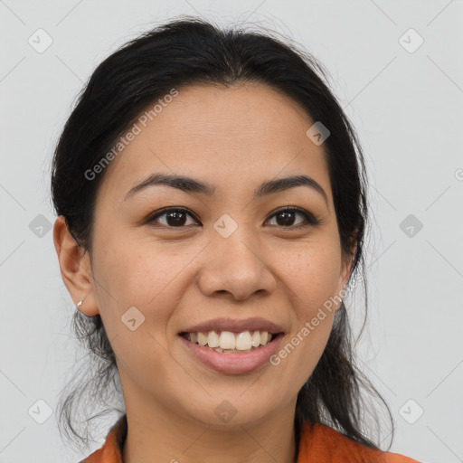 Joyful latino young-adult female with medium  brown hair and brown eyes