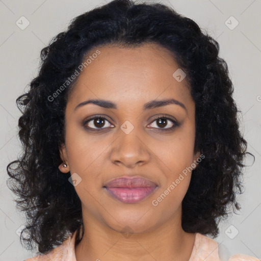 Joyful black young-adult female with long  brown hair and brown eyes