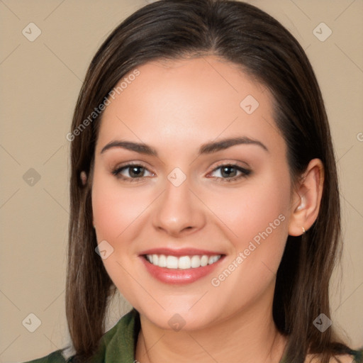 Joyful white young-adult female with long  brown hair and brown eyes