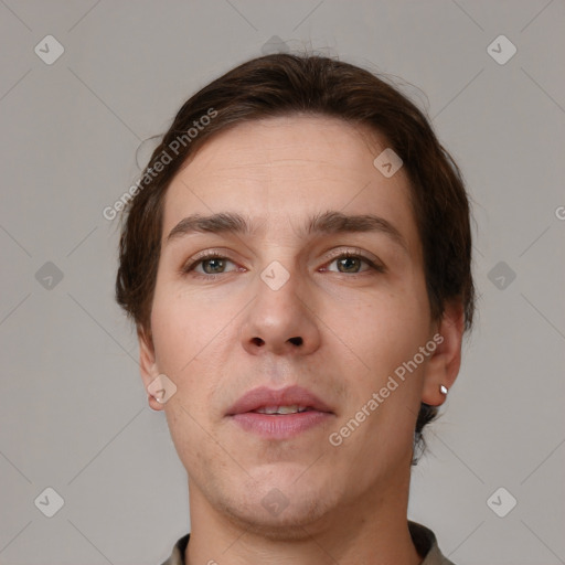 Neutral white young-adult male with short  brown hair and grey eyes