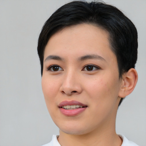 Joyful asian young-adult female with short  brown hair and brown eyes