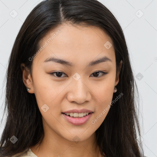 Joyful asian young-adult female with long  brown hair and brown eyes