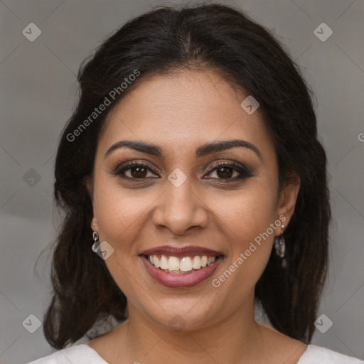 Joyful latino young-adult female with medium  brown hair and brown eyes