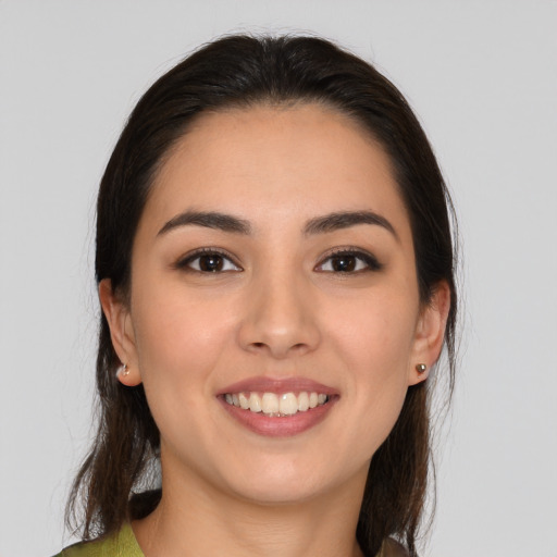 Joyful white young-adult female with medium  brown hair and brown eyes