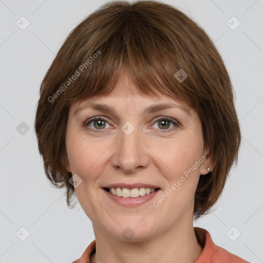 Joyful white adult female with medium  brown hair and grey eyes