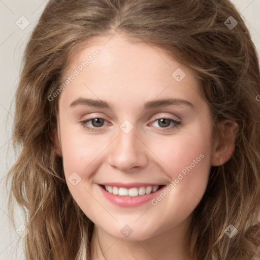 Joyful white young-adult female with long  brown hair and green eyes