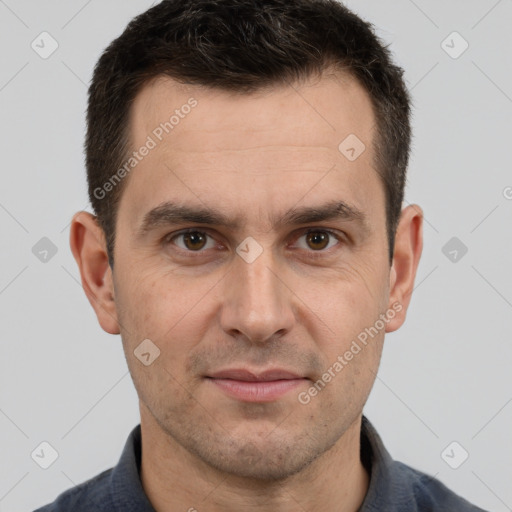 Joyful white adult male with short  brown hair and brown eyes