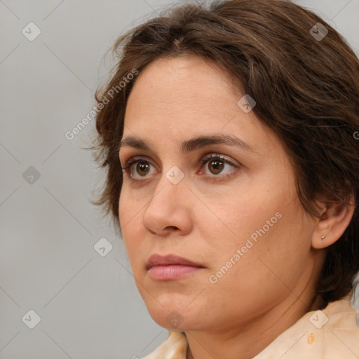 Neutral white adult female with medium  brown hair and grey eyes