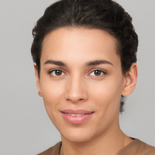 Joyful white young-adult female with short  brown hair and brown eyes