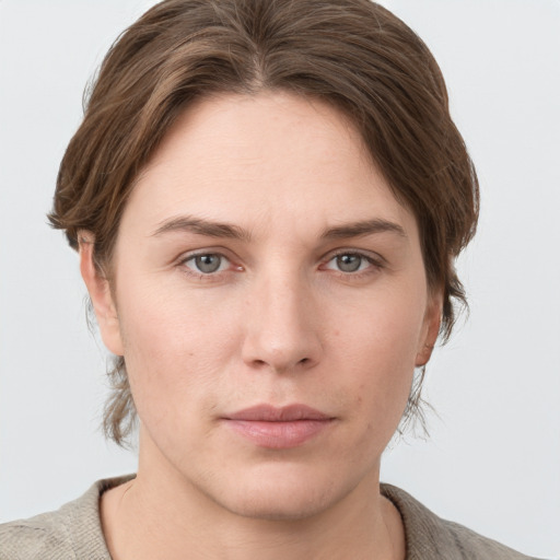 Neutral white young-adult female with medium  brown hair and grey eyes