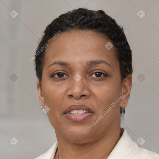 Joyful latino adult female with short  brown hair and brown eyes