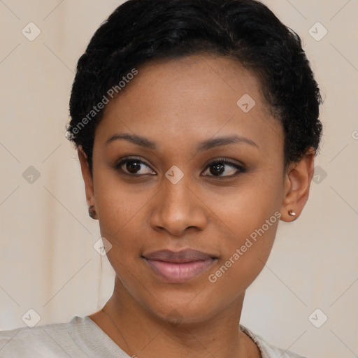 Joyful black young-adult female with short  black hair and brown eyes