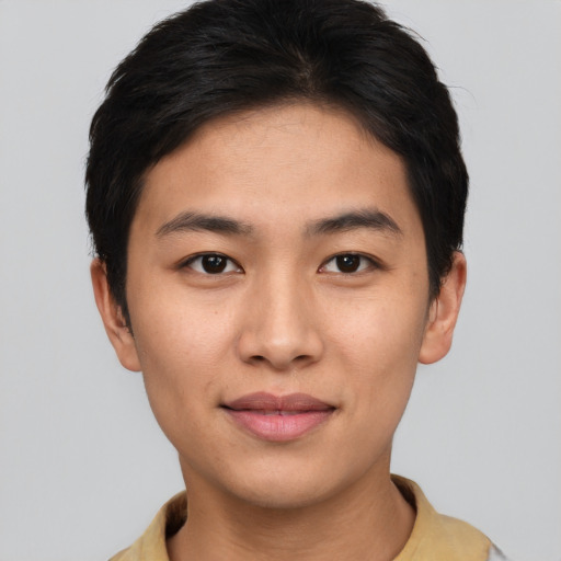 Joyful asian young-adult male with short  brown hair and brown eyes