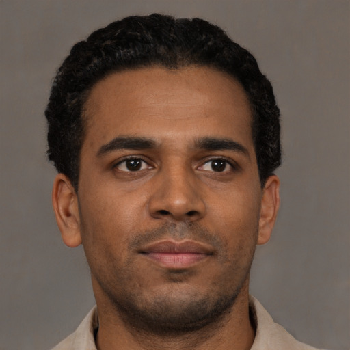 Neutral black young-adult male with short  brown hair and brown eyes