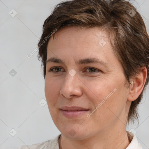 Joyful white adult female with medium  brown hair and brown eyes