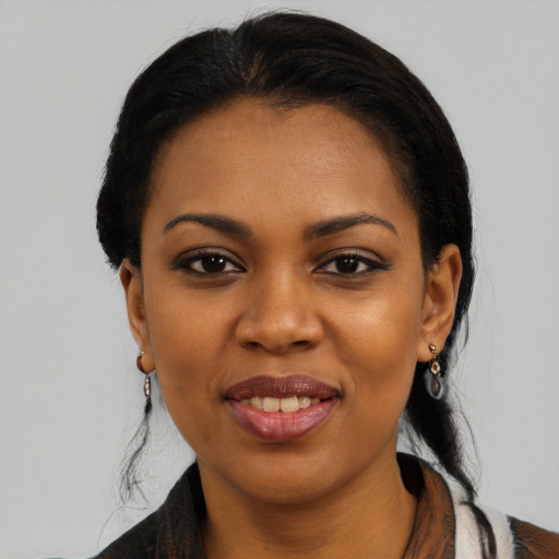 Joyful black young-adult female with medium  black hair and brown eyes