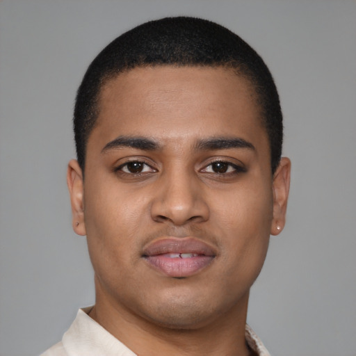Joyful latino young-adult male with short  brown hair and brown eyes
