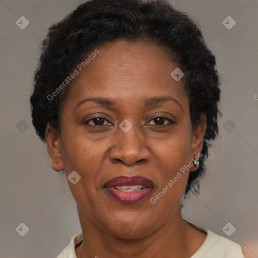 Joyful black adult female with short  brown hair and brown eyes