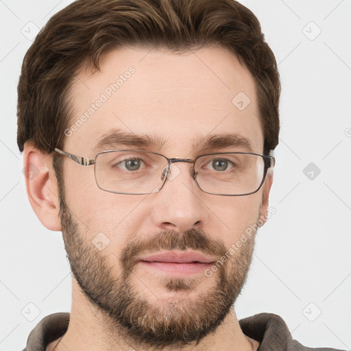 Joyful white adult male with short  brown hair and grey eyes