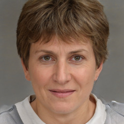 Joyful white adult female with short  brown hair and brown eyes