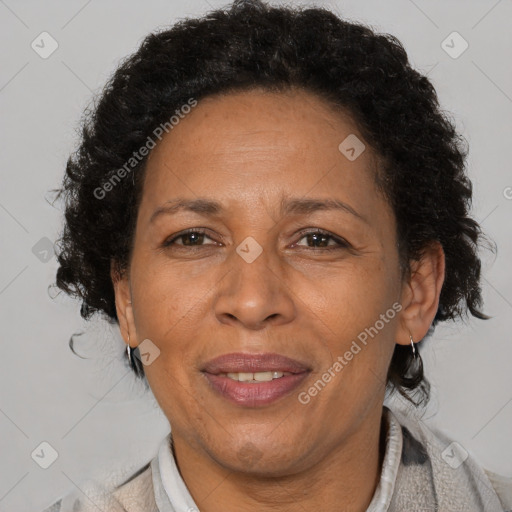 Joyful black adult female with short  brown hair and brown eyes