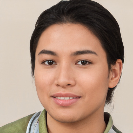 Joyful asian young-adult female with short  brown hair and brown eyes