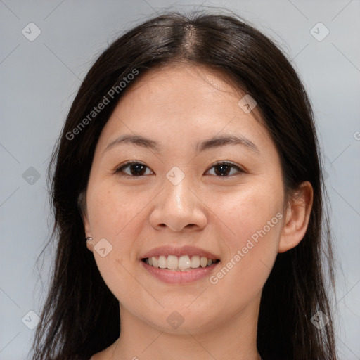 Joyful asian young-adult female with long  brown hair and brown eyes