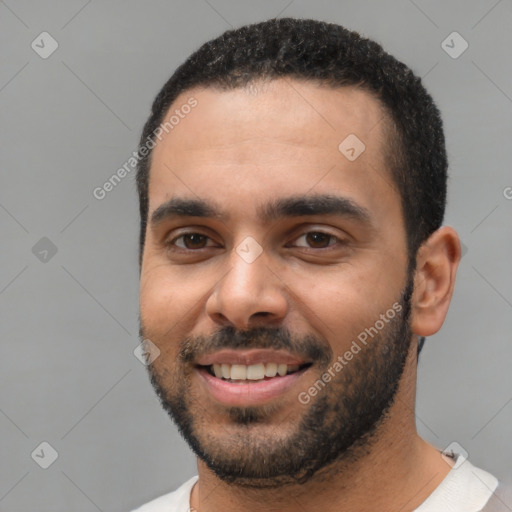 Joyful white young-adult male with short  black hair and brown eyes