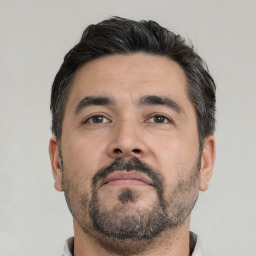 Neutral white adult male with short  black hair and brown eyes
