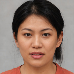 Joyful asian young-adult female with medium  brown hair and brown eyes