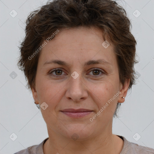 Joyful white adult female with short  brown hair and brown eyes