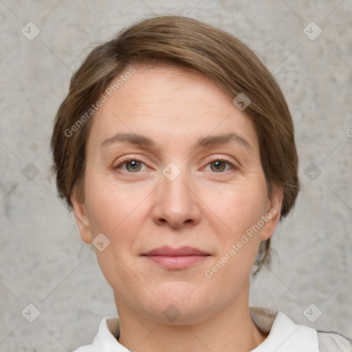 Joyful white adult female with short  brown hair and grey eyes