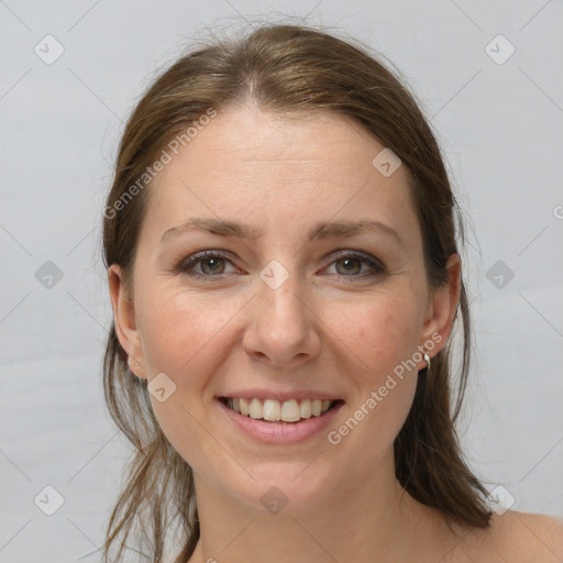 Joyful white adult female with medium  brown hair and grey eyes