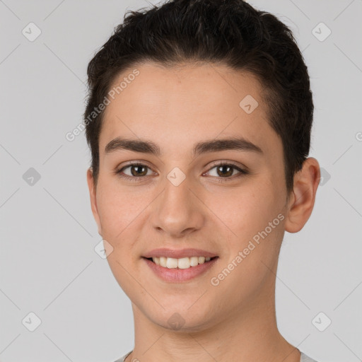 Joyful white young-adult female with short  brown hair and brown eyes