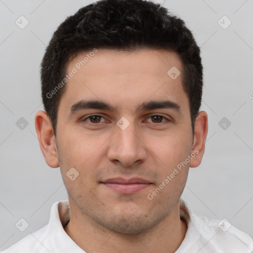 Joyful white young-adult male with short  brown hair and brown eyes