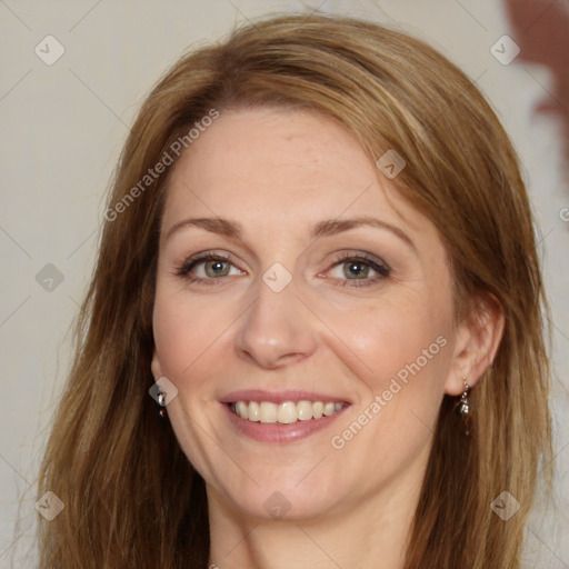 Joyful white adult female with long  brown hair and brown eyes