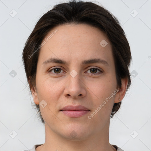 Joyful white young-adult female with short  brown hair and brown eyes