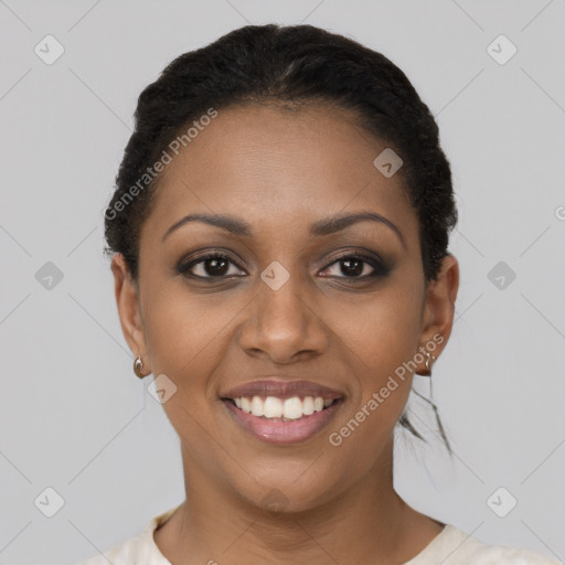 Joyful black young-adult female with short  brown hair and brown eyes