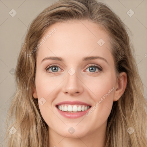 Joyful white young-adult female with long  brown hair and green eyes