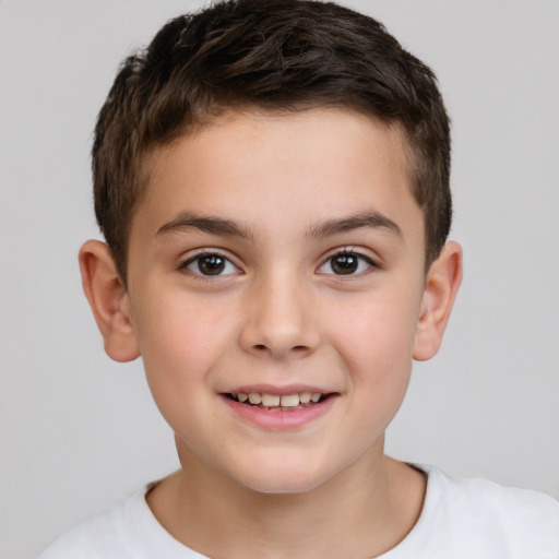 Joyful white child male with short  brown hair and brown eyes