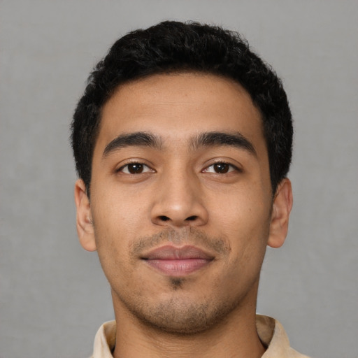 Neutral latino young-adult male with short  black hair and brown eyes